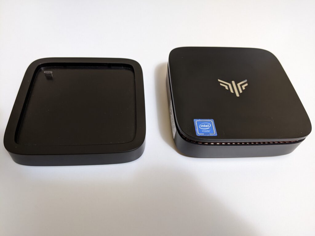 Image of the Kamrui AK1 Pro Mini PC side by side with detachable hard drive bay.