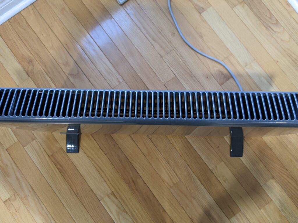 Top down view of the panel heater showing the grill where hot air is expelled
