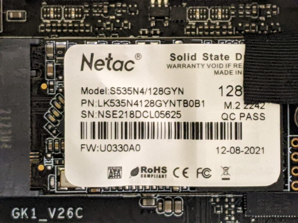 Image showing the inside of the mini pc .  Specifically showing the 128GB Netac M.2 SATA SSD (2242) which can be swapped out