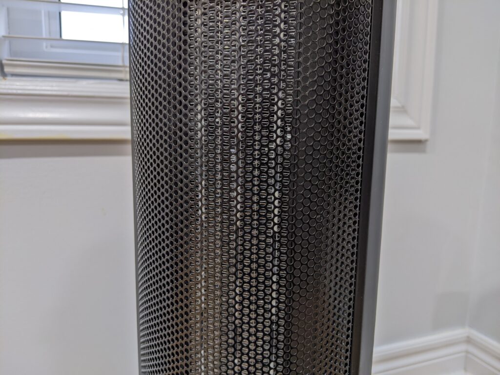 Focused image on the front grill of the Paris Rhone tower heater which shows the ceramic blocks and aluminum fins